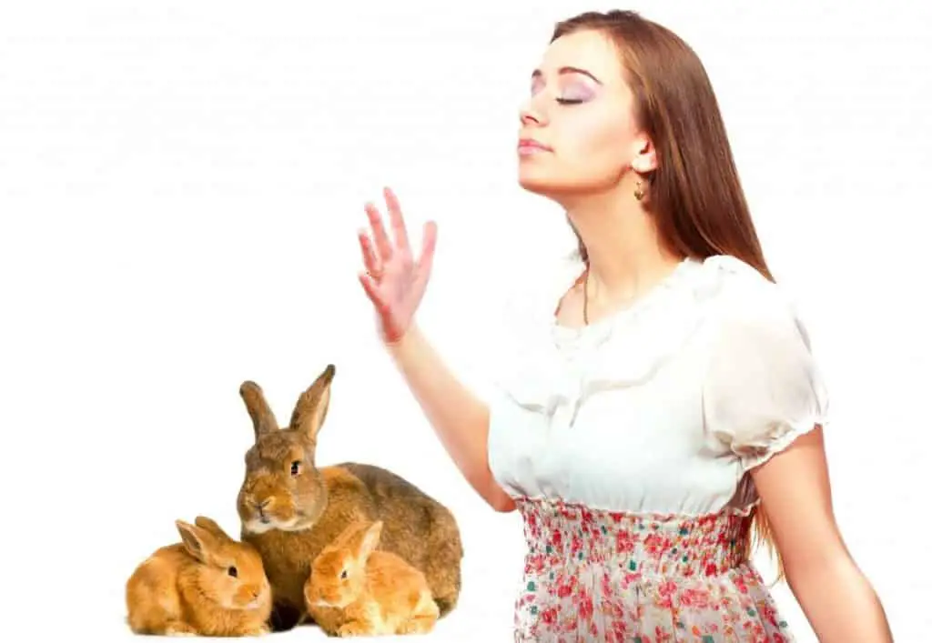 Image of girl smelling for rabbit pee stink